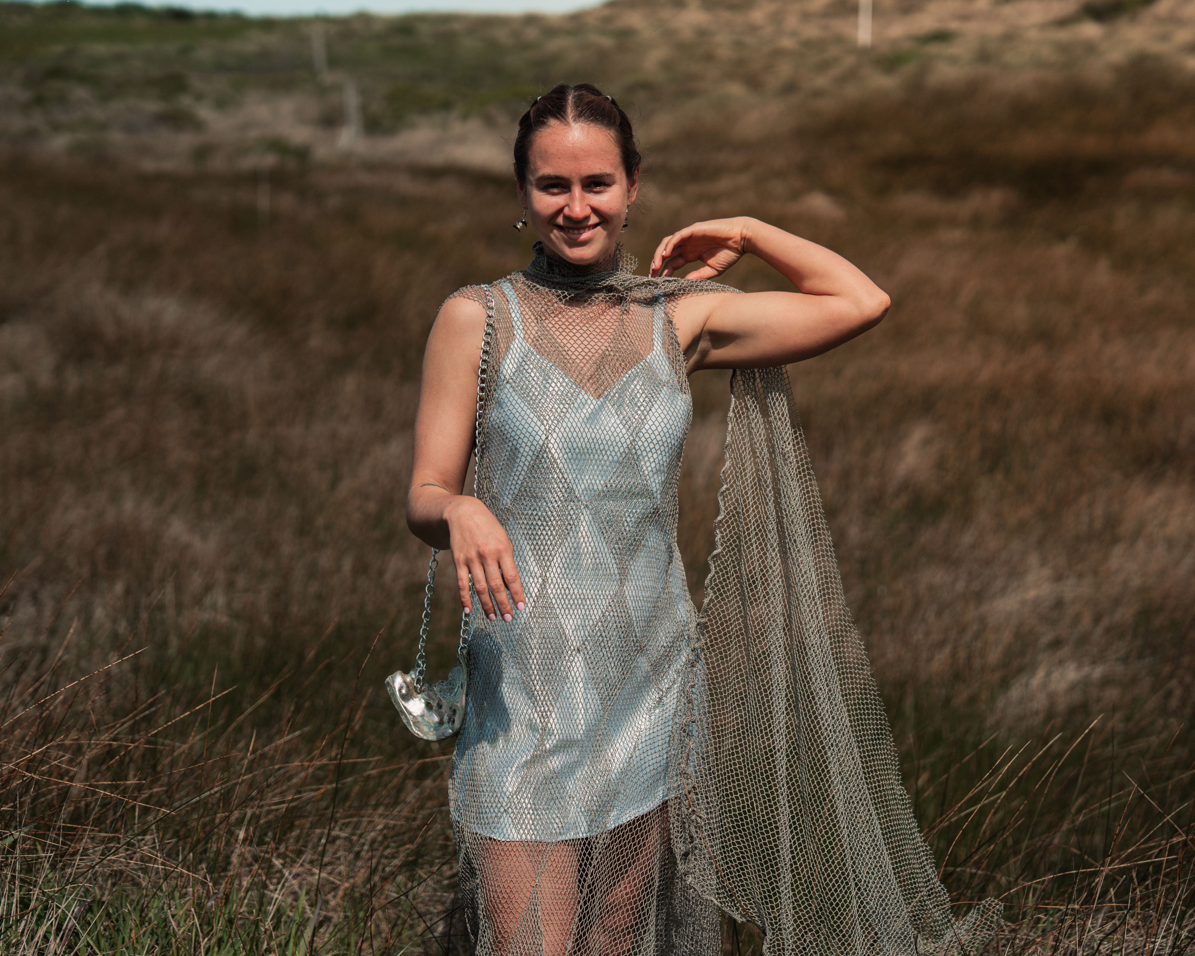 Deva wearing net dress with cyanotype slip