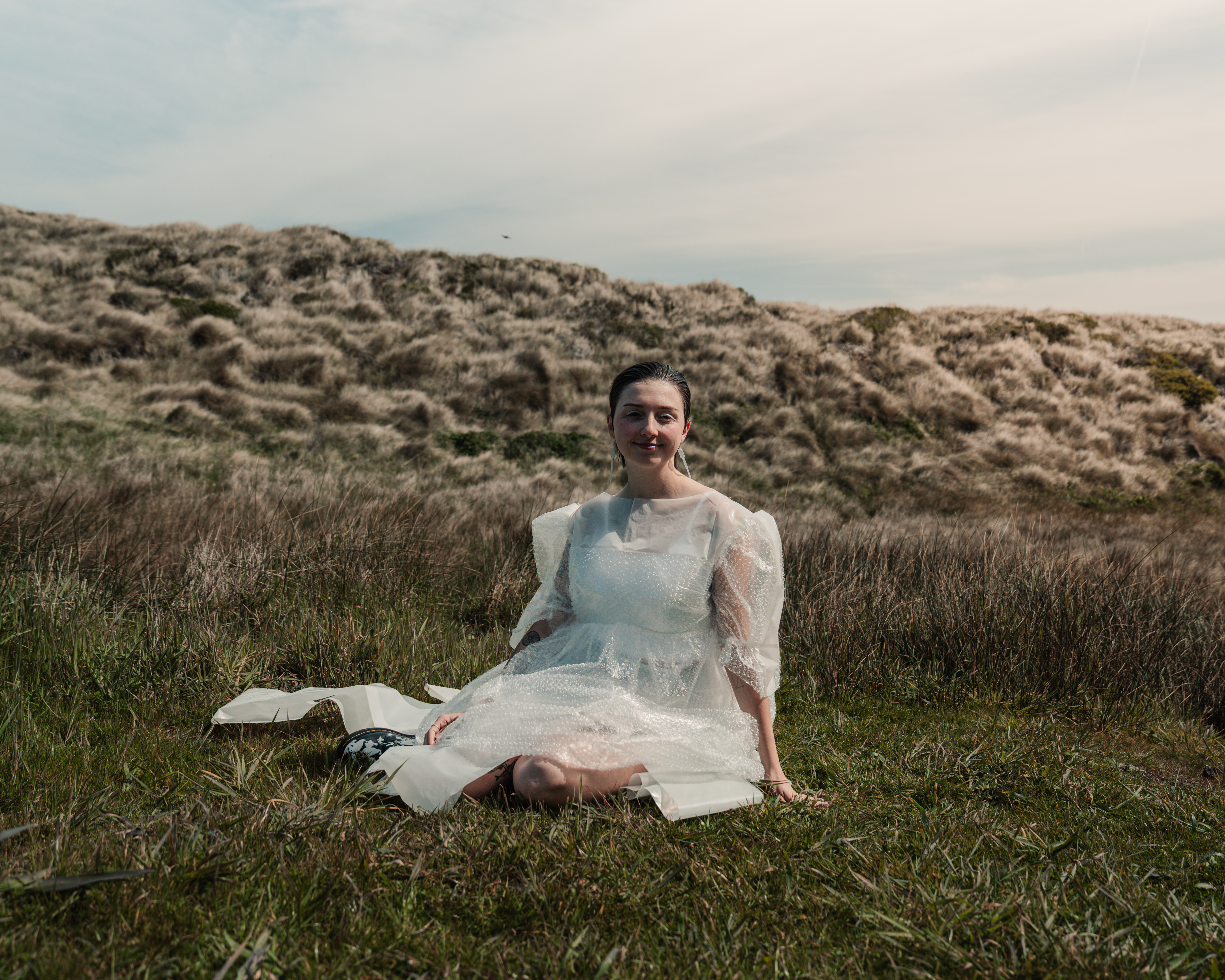 Maddie wearing plastic and bubble wrap dress