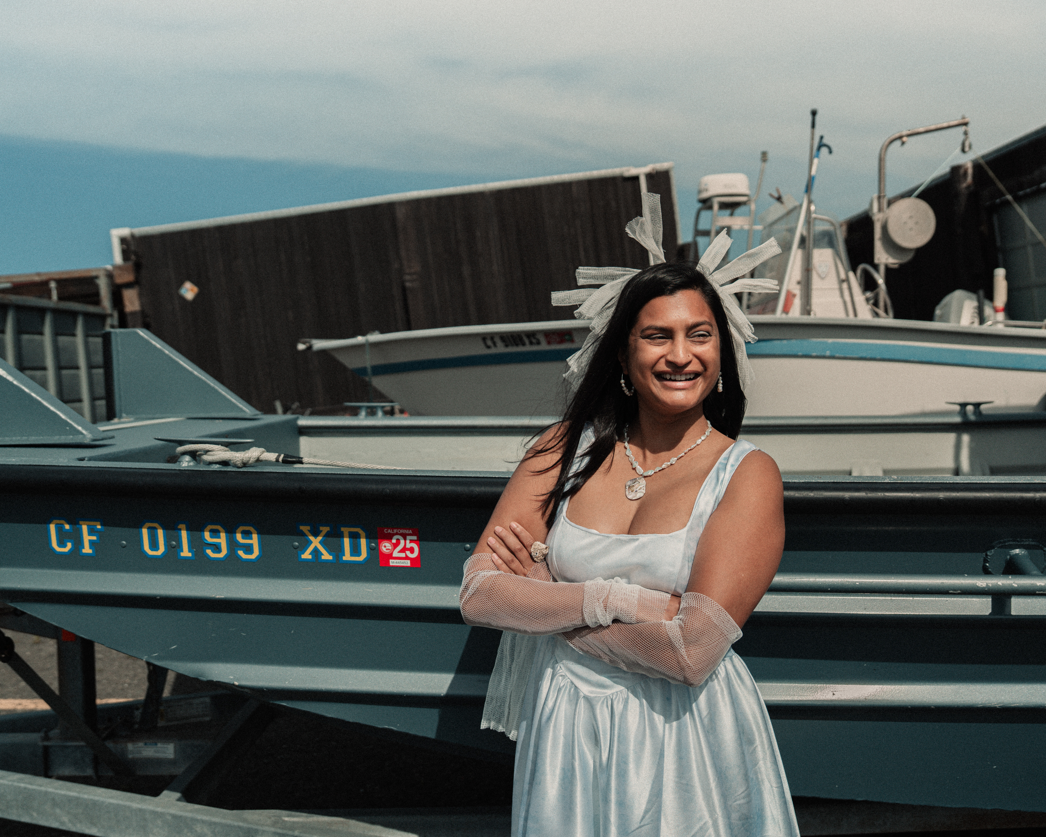 Shreya wearing cyanotype dress and garlic bag accessories